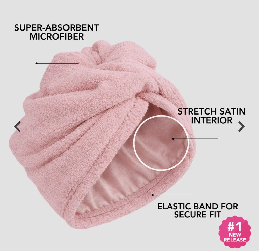 Pink Hairbrella towel turban with labels identifying its microfiber exterior, stretch satin interior, and elastic band.