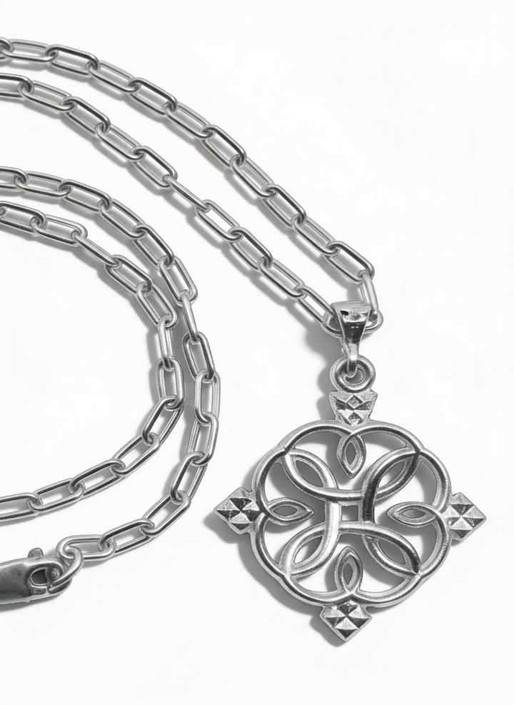 Silver-tone Liya 1.0 circular cross pendant with its chain and clasp arranged on a white background