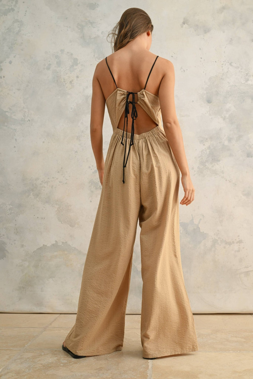 CRINKLED FABRIC JUMPSUIT WITH CONTRAST STRAP: TAN/BLACK - The Village Retail