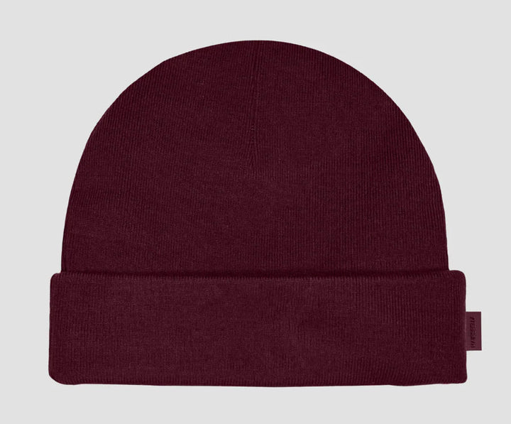 Deep plum Hairbrella kids cuffed beanie with a folded brim and small side label.